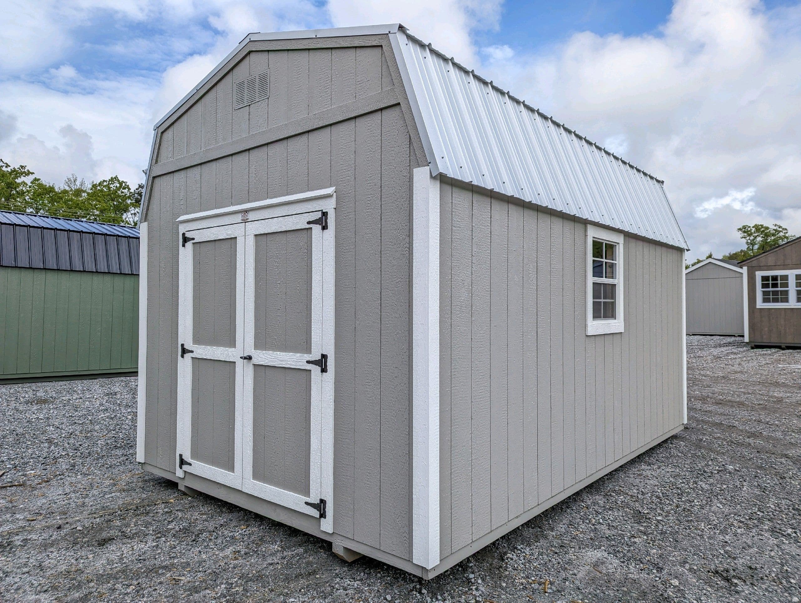 10x16 grey wood sided DUTCHBARN with white trim light grey metal roofing with the door on the short side for sale in SC