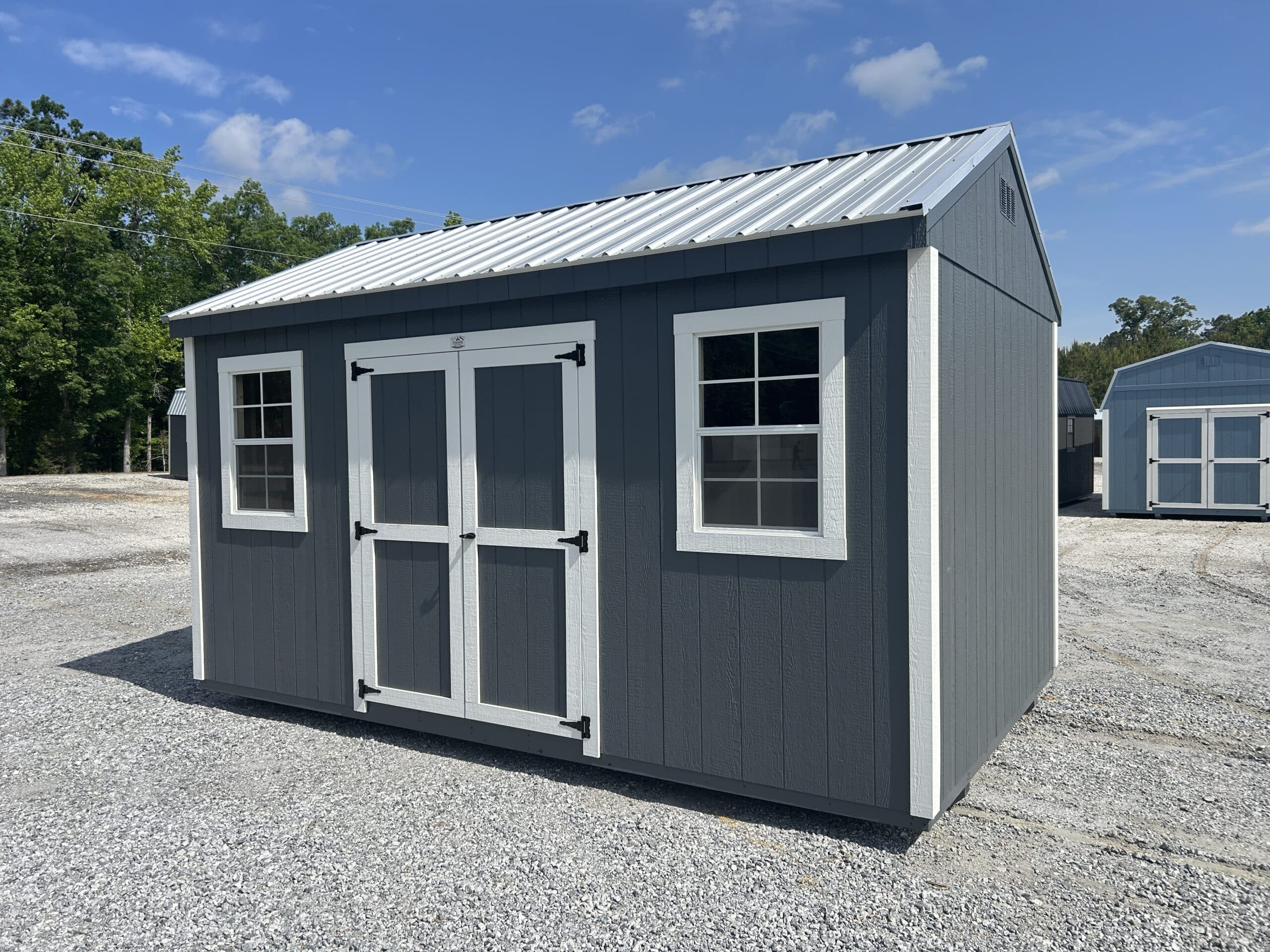 10x16 blue workshop shed with white trim and silver metal roof for sale in SC