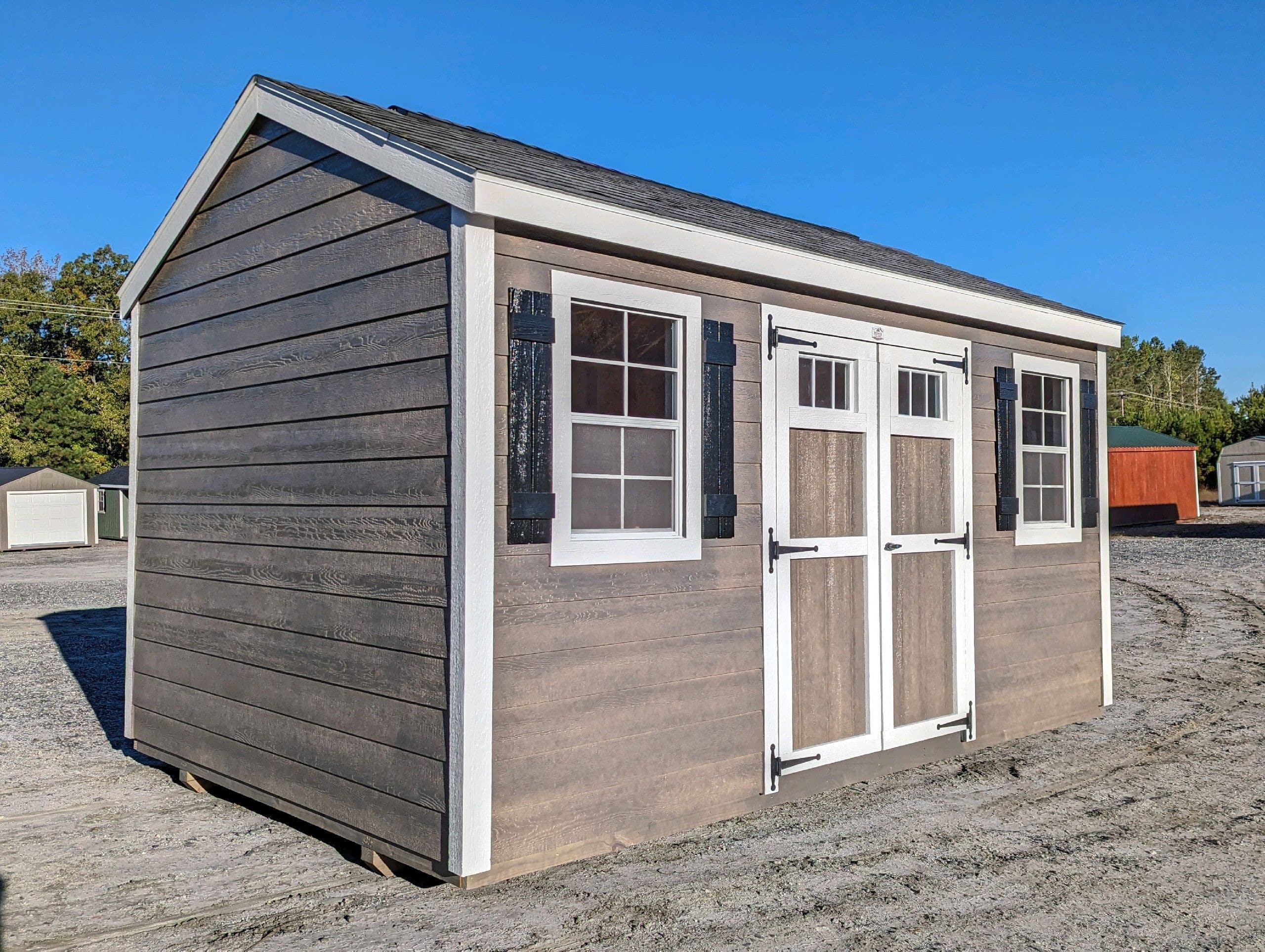 10x16 brown classic workshop shed with white trim and black asphalt shingle roofing for sale in SC
