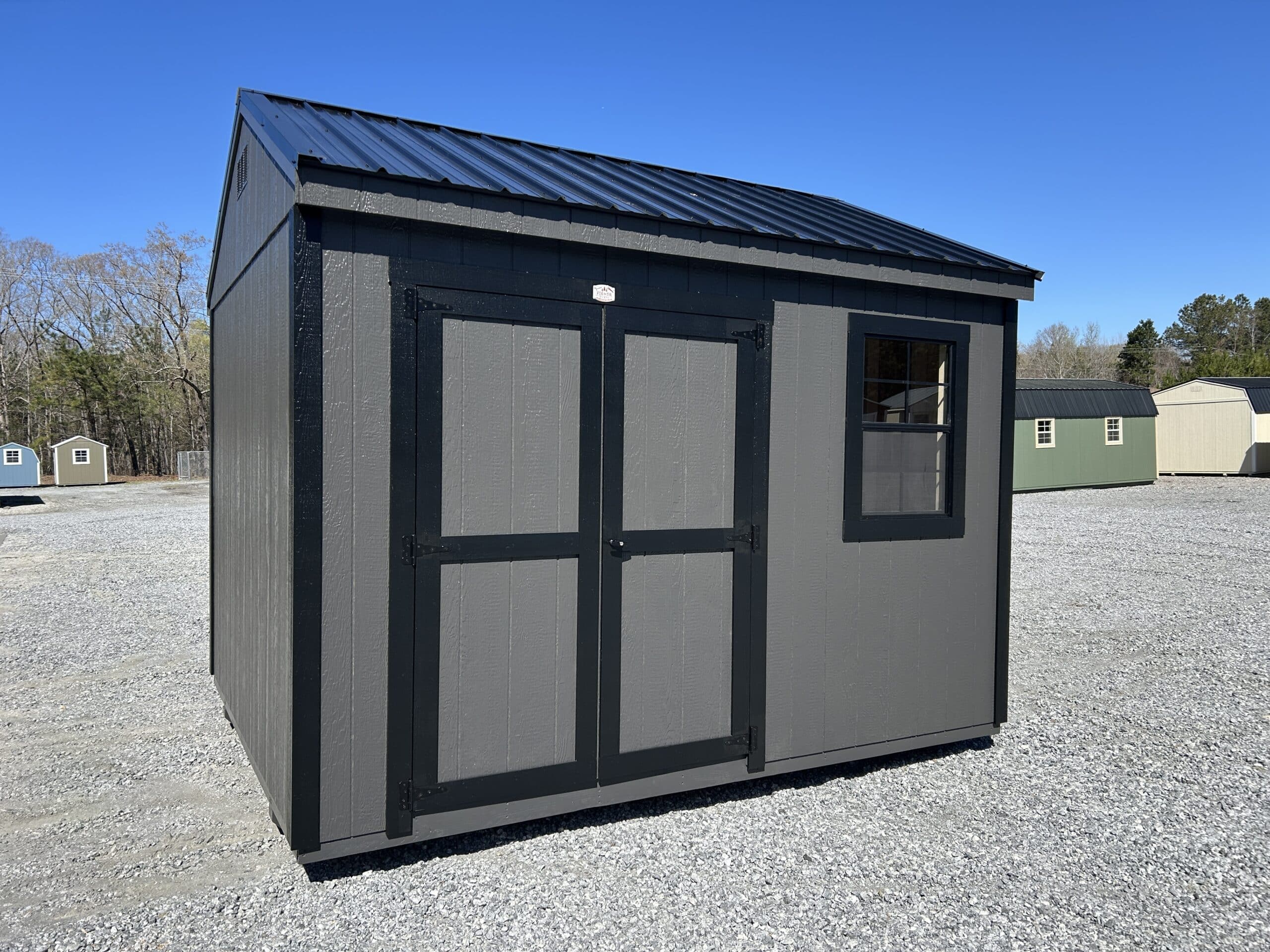 12x12 workshop shed with Iron Ore Wood Siding black trim and black metal roof in SC