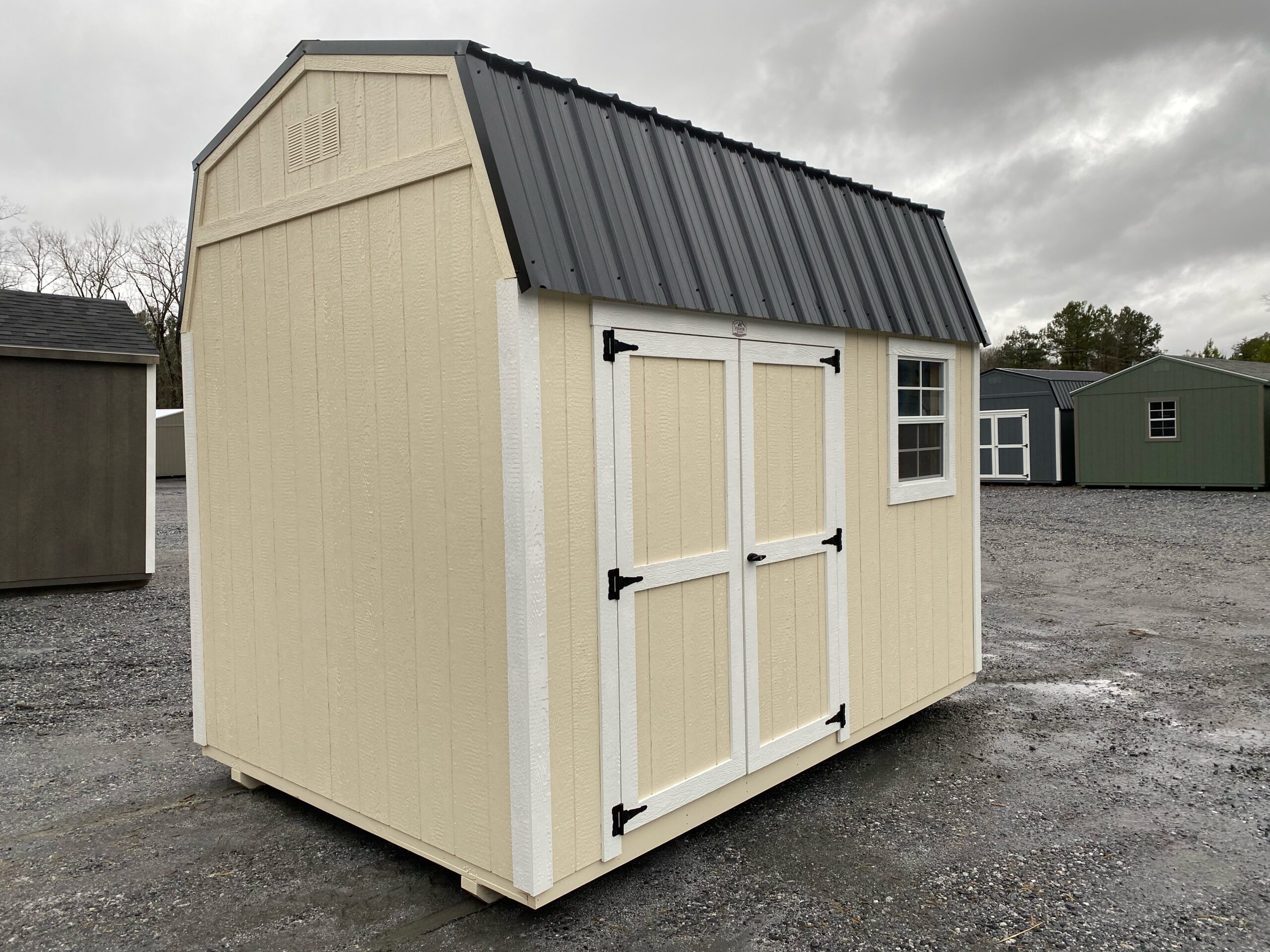 8x16 cream with white trim and black metal DUTCHBARN shed for sale in SC