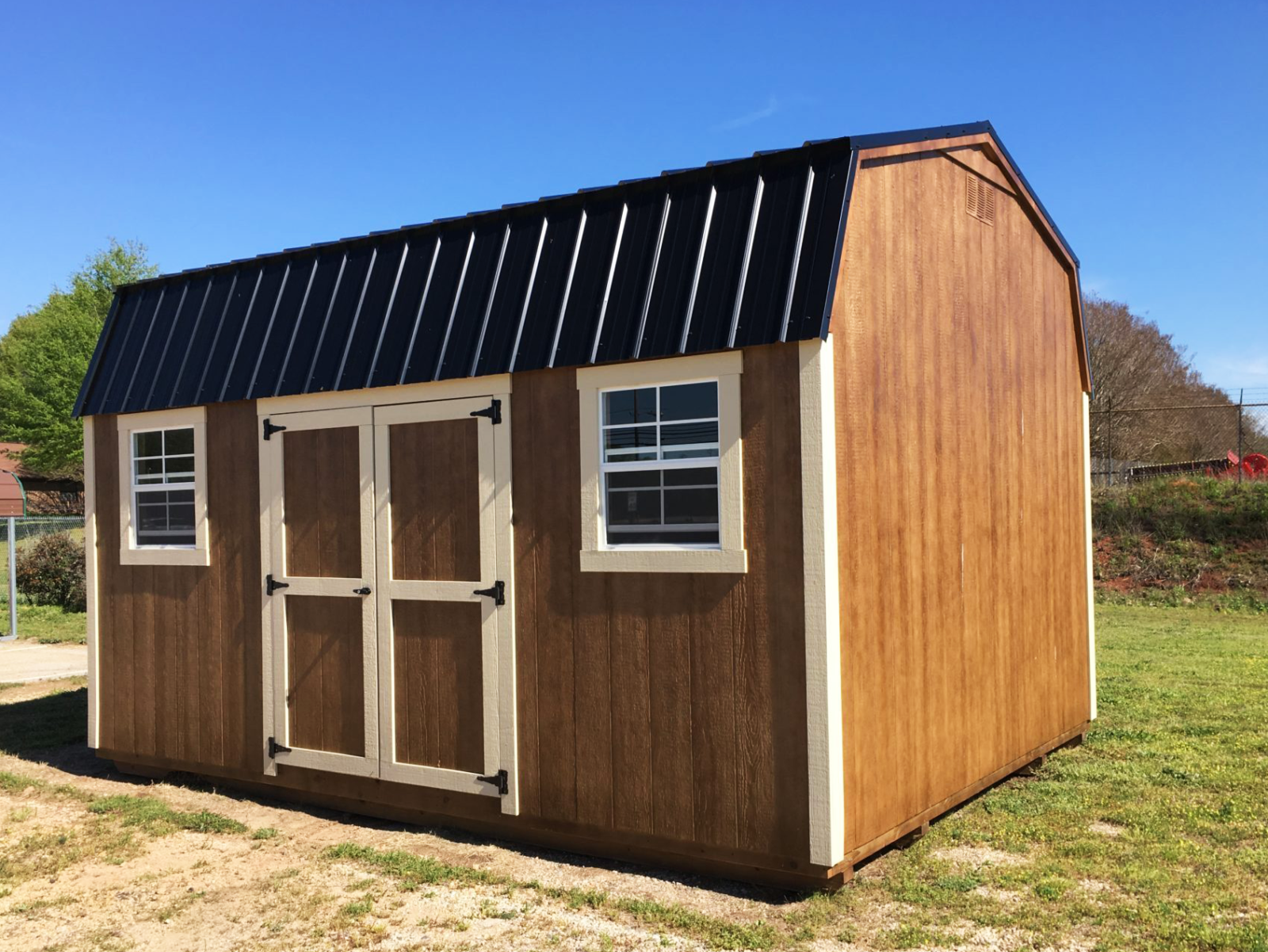 exterior of a brown lofted shed for sale