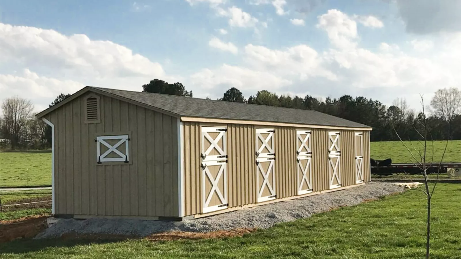 exterior of single line shed row barns for sale