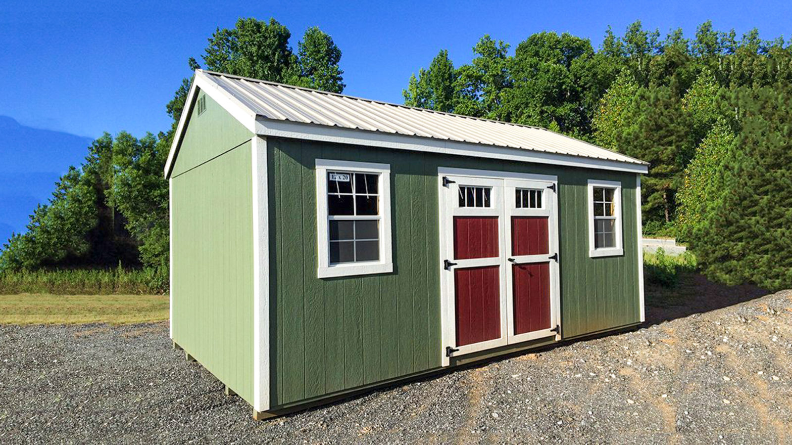 exterior of green pre-built storage shed for sale