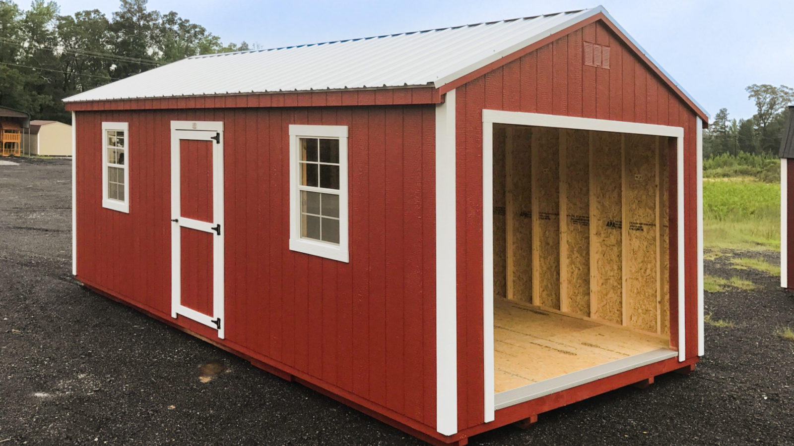 exterior of red and white pre-built garage for sale