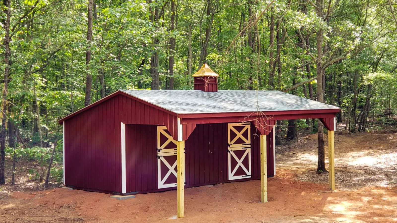 exterior of red horse lean to shed near woods in SC